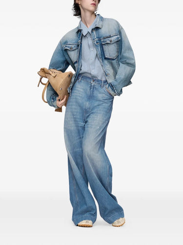 Front view of model wearing the long-sleeved shirt in light blue and grey from Maison Margiela