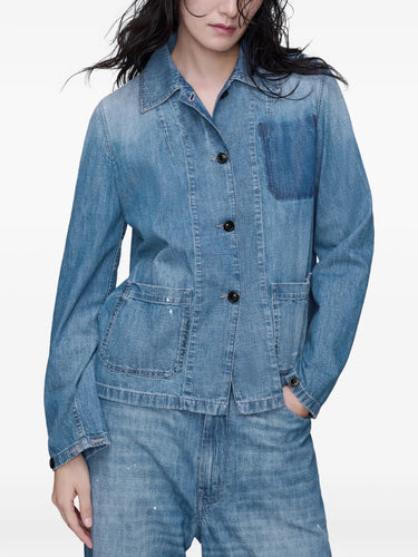 Close-up front view of a model wearing the Long-Sleeved Shirt in Medium Blue Vintage by Maison Margiela, focusing on the denim texture, classic collar, and button closure.