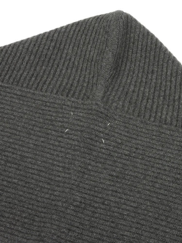 Close-up back view of the Maison Margiela scarf, highlighting the signature four white stitches on the dark grey ribbed knit.