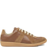 Brown leather sneakers with panel design from Maison Margiela on a white background