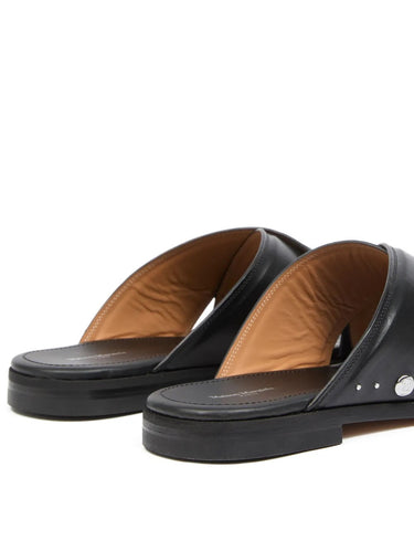 Tabi Numbers Crossed Sandal in Black black calf leather sandal with silver-tone hardware and flat sole, diagonal back view – Maison Margiela