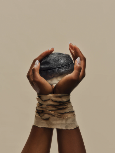 Hands holding the ECCO Manuel Mathieu perfume