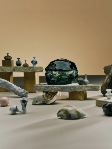 Arrangement of ceramic and glass pieces on a neutral background