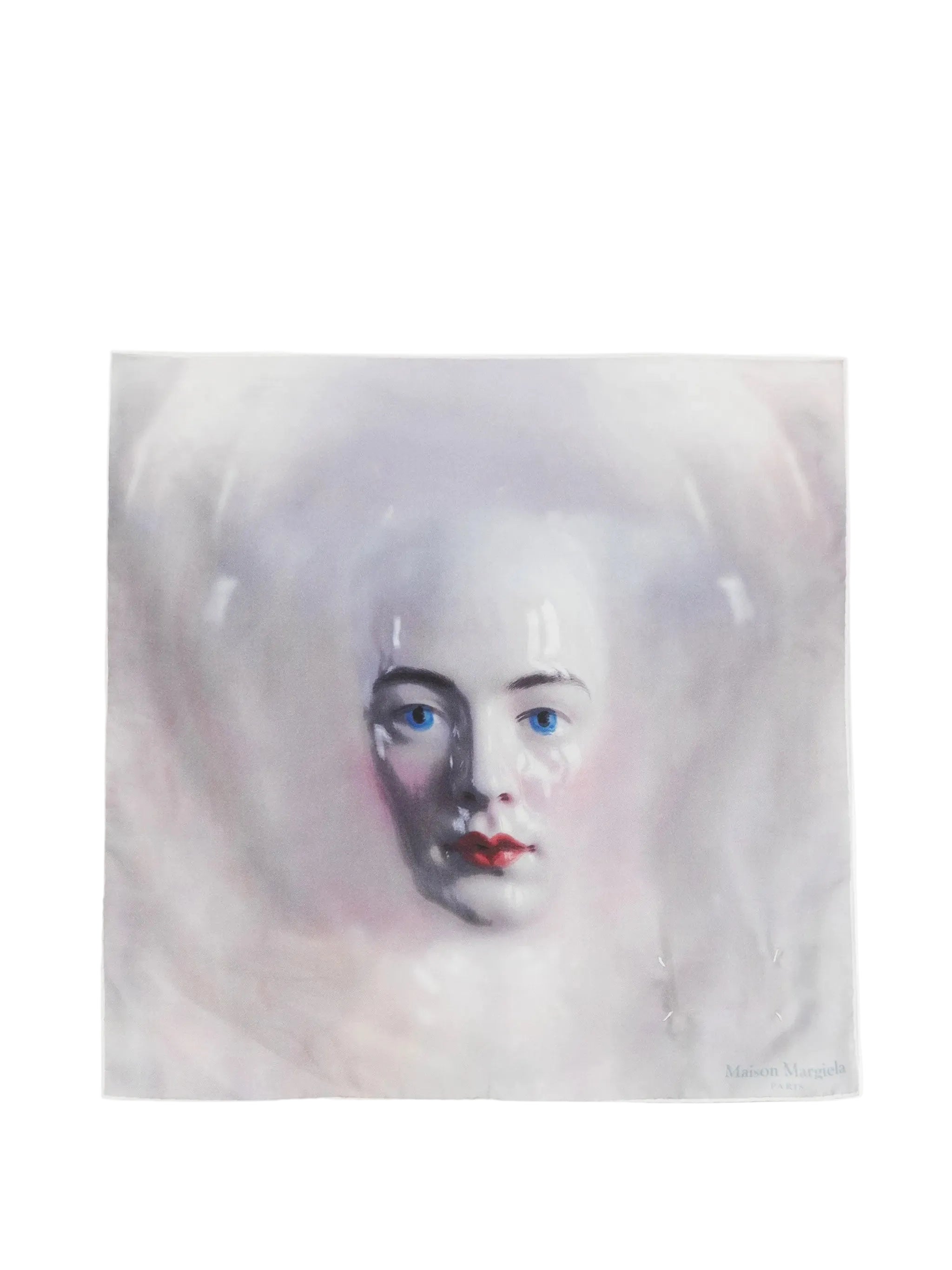 Maison Margiela Silk Scarf Porcelain Doll Print 45X45 in Blue shown flat, featuring a blurred porcelain doll portrait, logo detail and signature four white stitches.