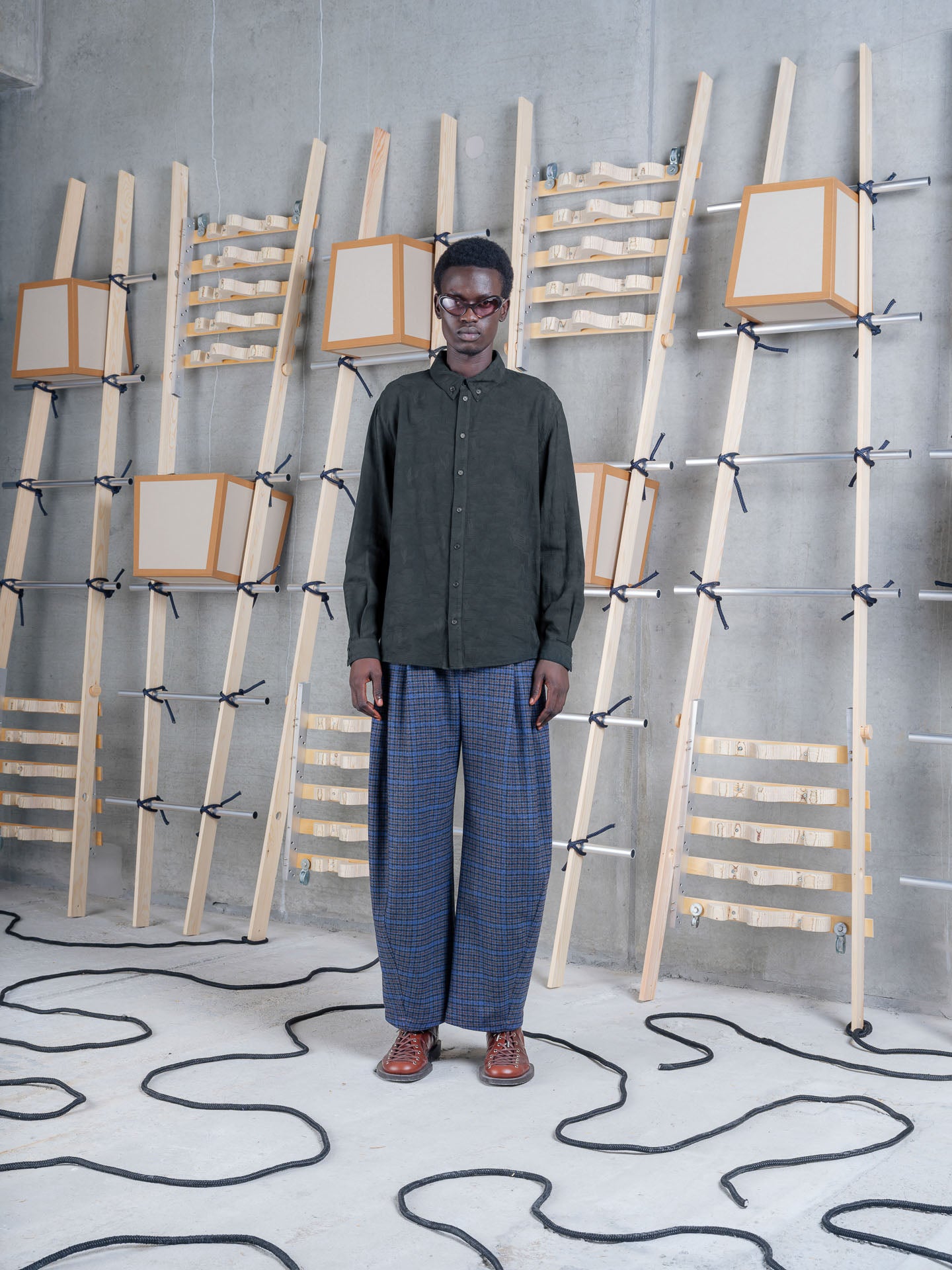 Model wearing Henrik Vibskov One Pants in Blue Wool Checks front view
