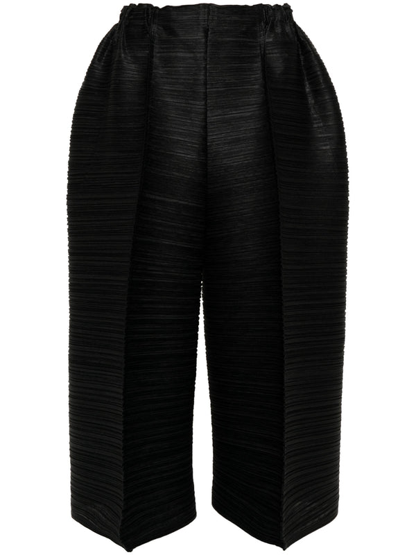 Pleats Please Issey Miyake - cropped bounce pleat pants in black - 1