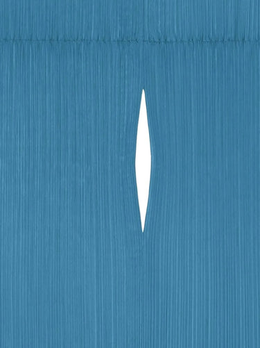 Close-up of a multi-functional garment from Pleats Please Issey Miyake in blue tone.