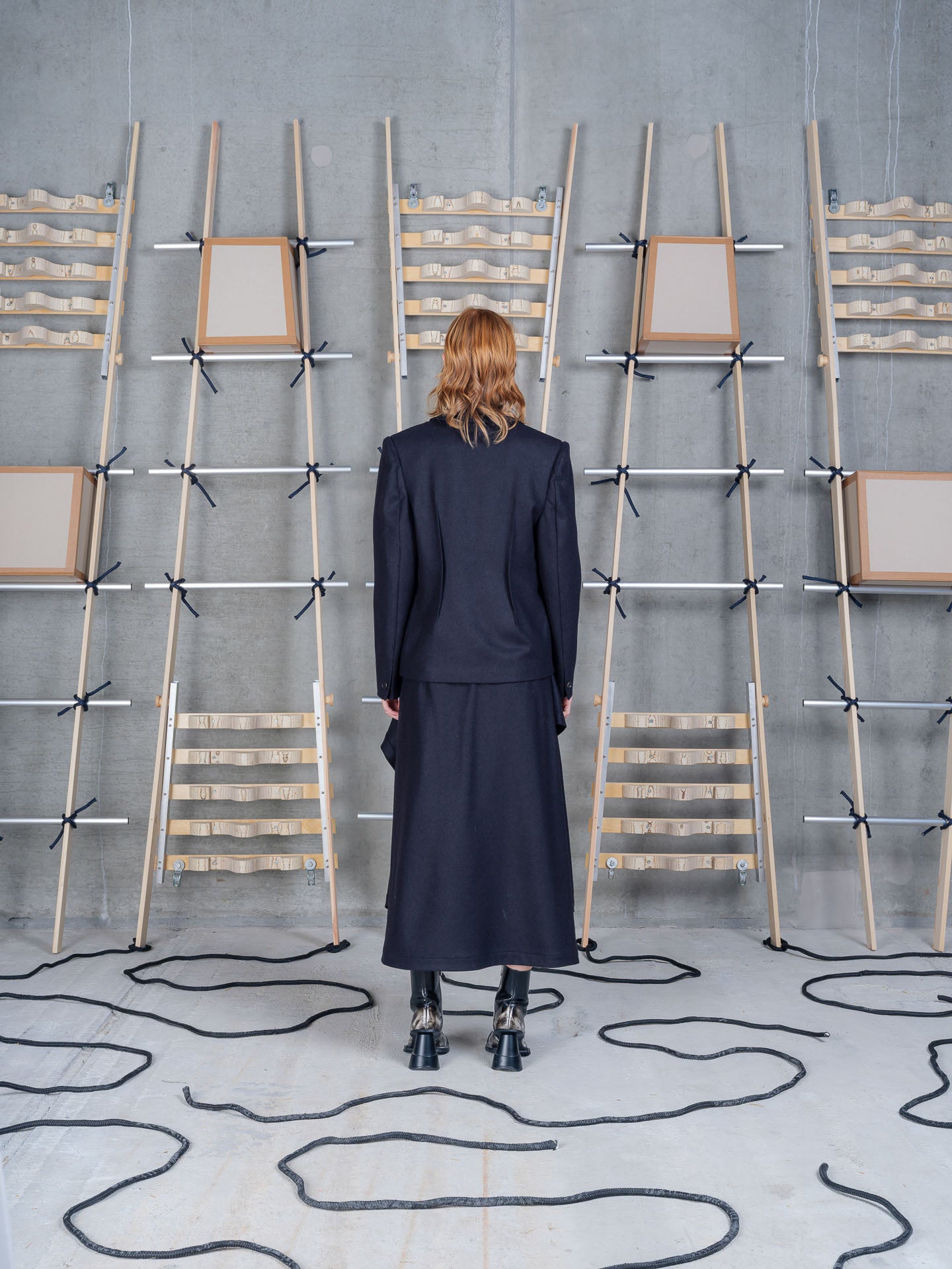 Model wearing Henrik Vibskov Press Blazer in Black back view
