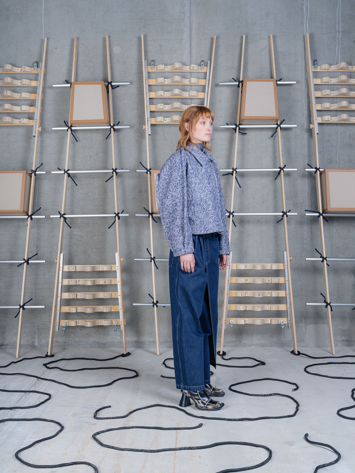 Model wearing Relaxed Dartbi Jacket in Blue Pebbles by Henrik Vibskov three-quarter view
