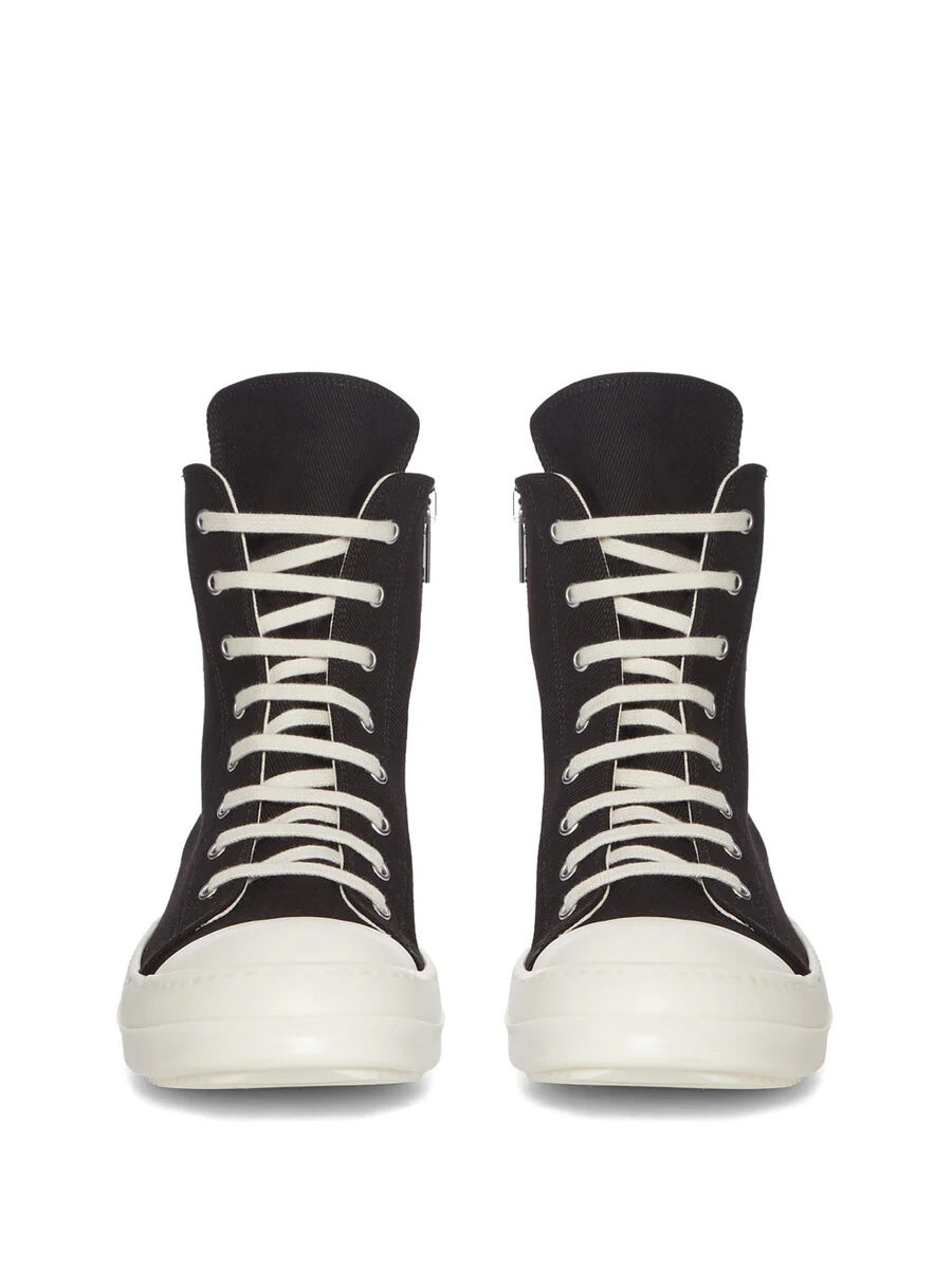 Front view of Rick Owens DRKSHDW AW26 Sneaks in black canvas with milk white laces, rubber toe caps and silver-tone eyelets