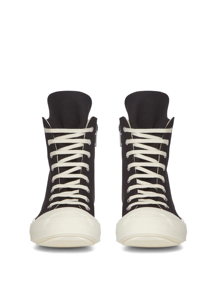 Front view of Rick Owens DRKSHDW Tower Sneaks in Black Overdyed Denim with black high-top silhouette, milk white laces and extended textured rubber toe caps