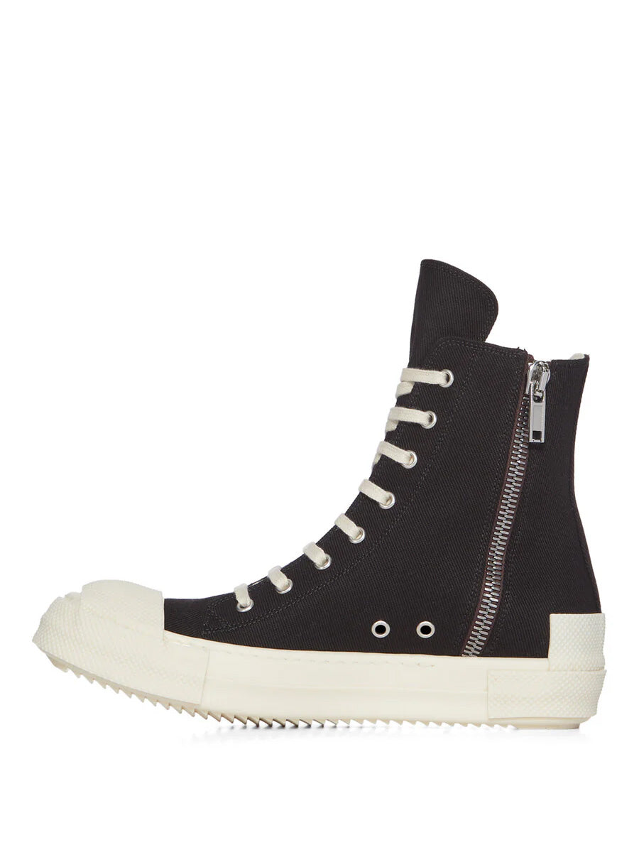 Side view of Rick Owens DRKSHDW Tower Sneaks in Black Overdyed Denim showing milk white extended toe cap, silver side zip and contrasting milk white sole