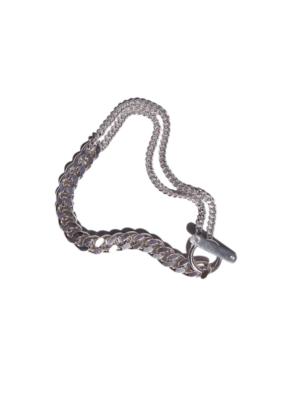 Packshot of the Grand Bracelet Mixed in Silver from the Saskia Diez Spring Summer 2026 collection, showing the bold recycled-silver curbed chain with toggle closure.