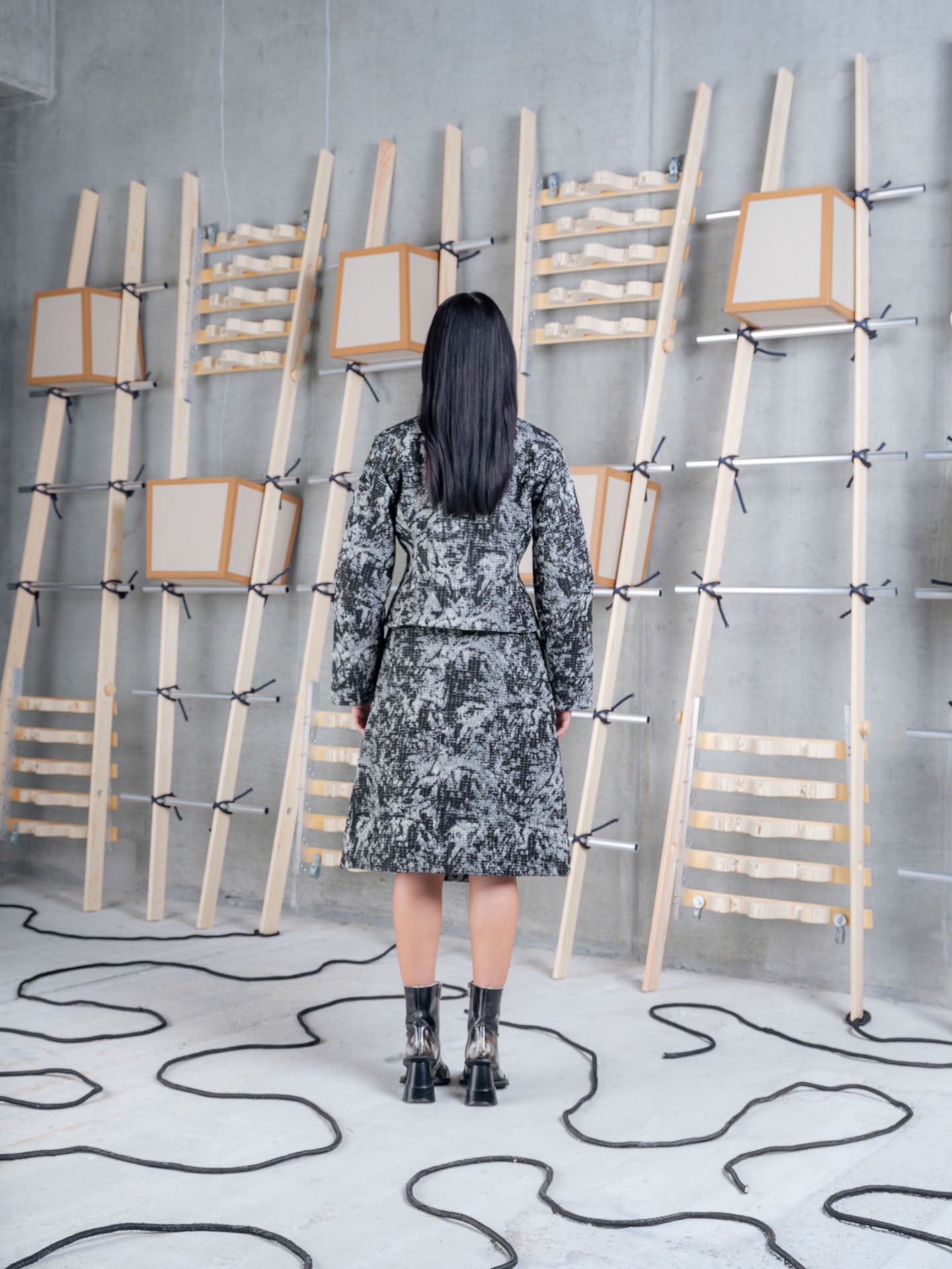 Henrik Vibskov Shell Jacket in Black 3D White worn back view
