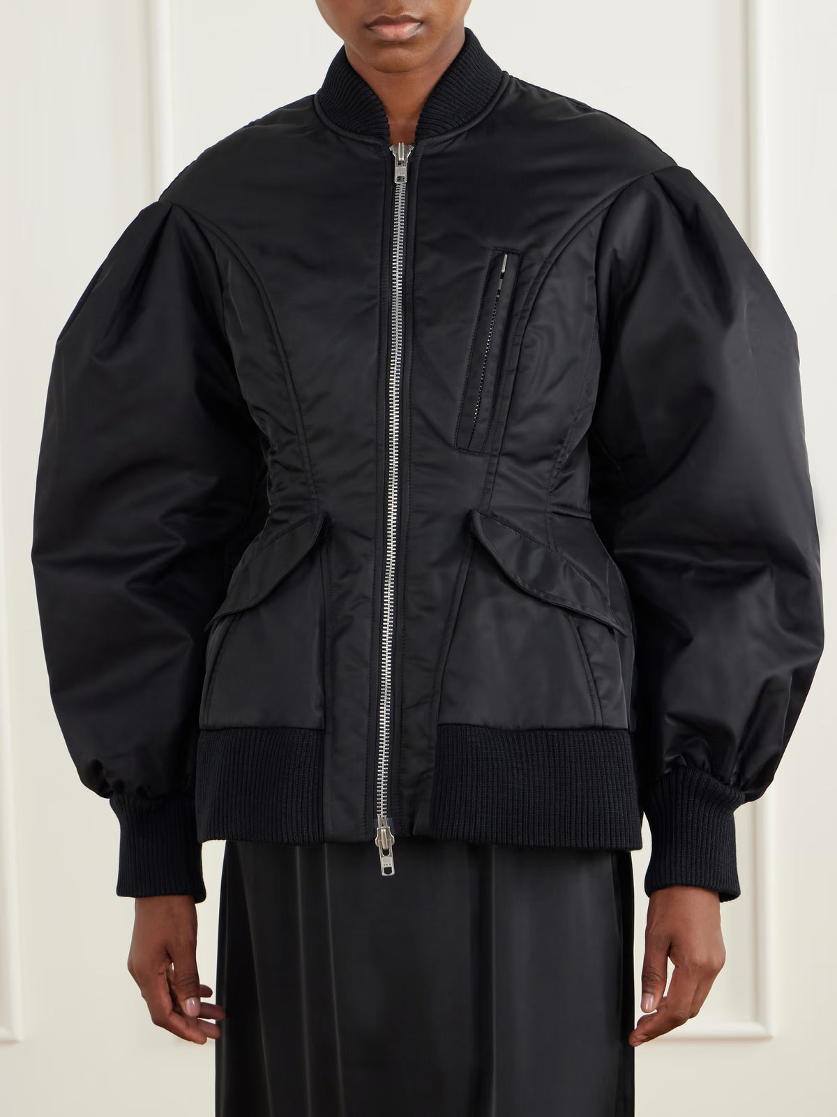 Simone Rocha Padded Sculpted Bomber Jacket in Black worn from the front, showing the sculpted waist, chest zip pocket and flap pockets.