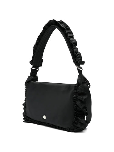 Reverse side view of the Pillowcase Shoulder Bag in black, highlighting the smooth nylon construction and strap attachment.