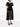 Black sheer dress worn by a model on a white background