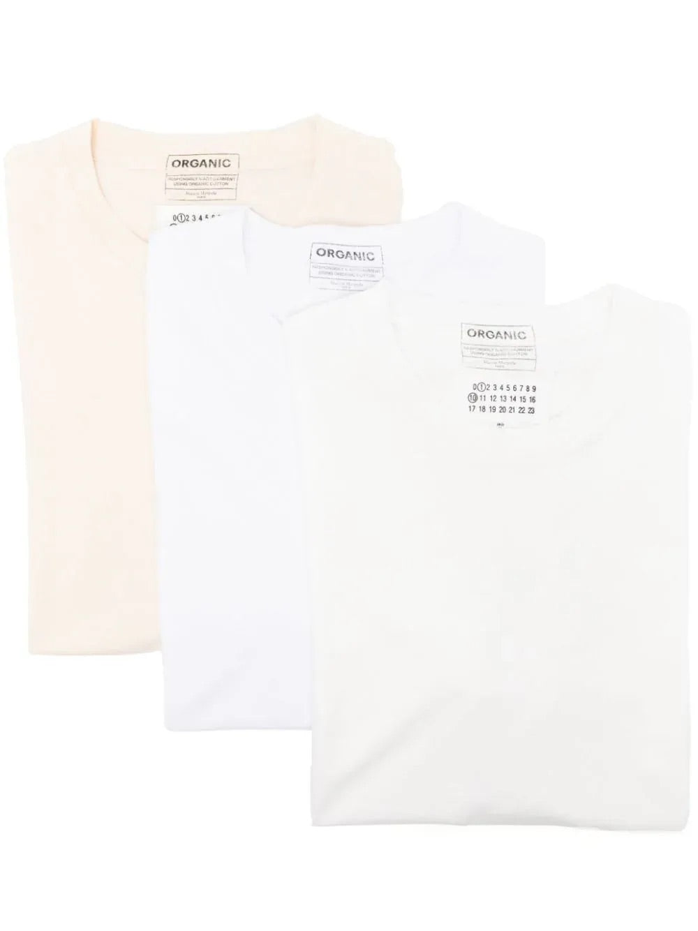 Three Maison Margiela T-shirts in off-white, white, and snow shades, folded to showcase the crew neck and minimalist design.
