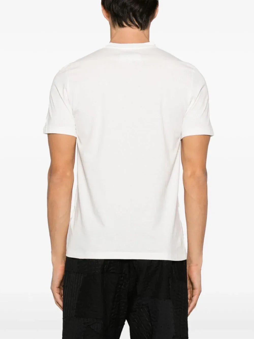 Back view of the Maison Margiela Snow T-shirt on a model, featuring a straight hem and signature neck detailing.