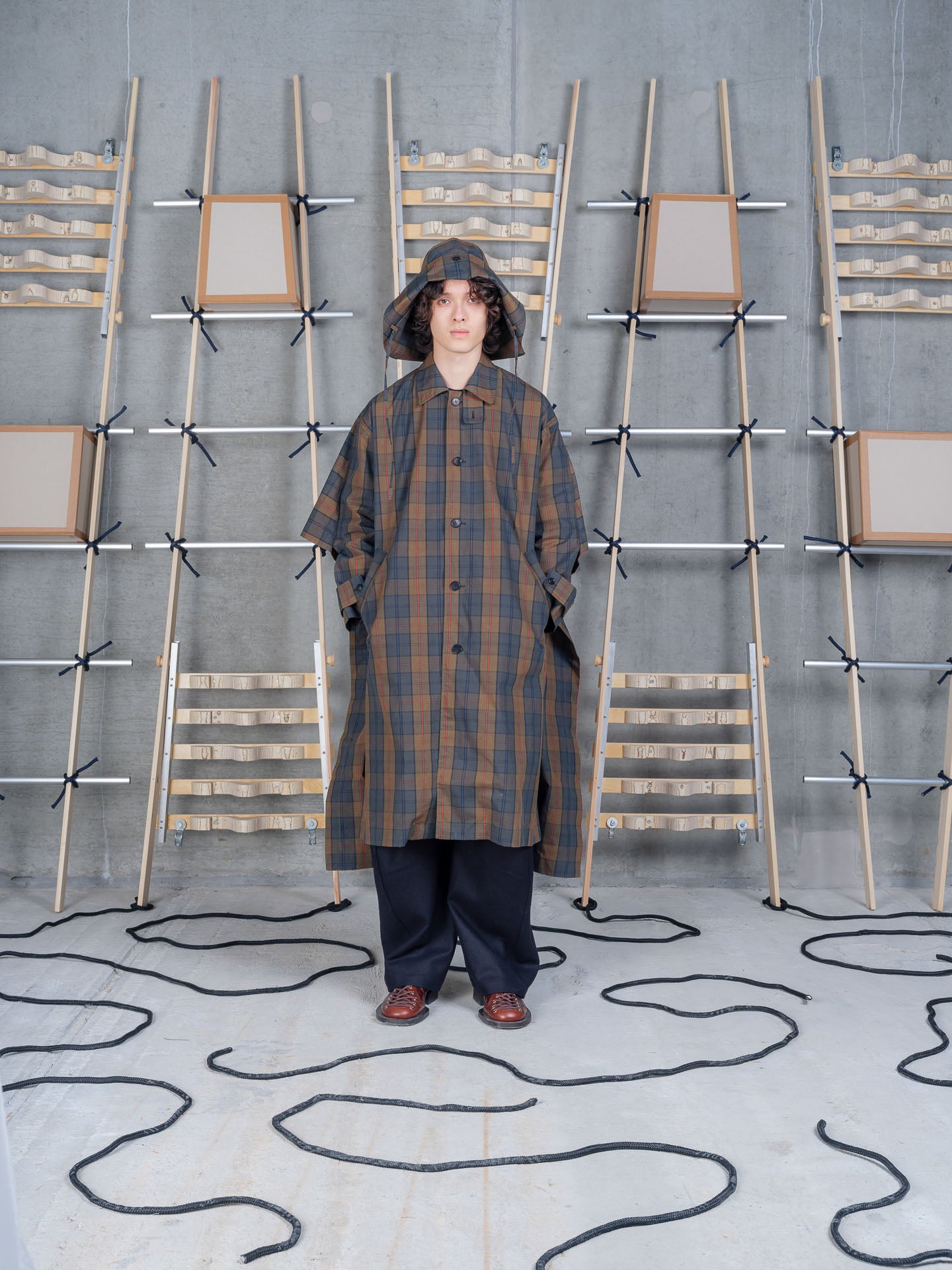 Henrik Vibskov Uncut Coat in Tartan Dry Wax worn front view
