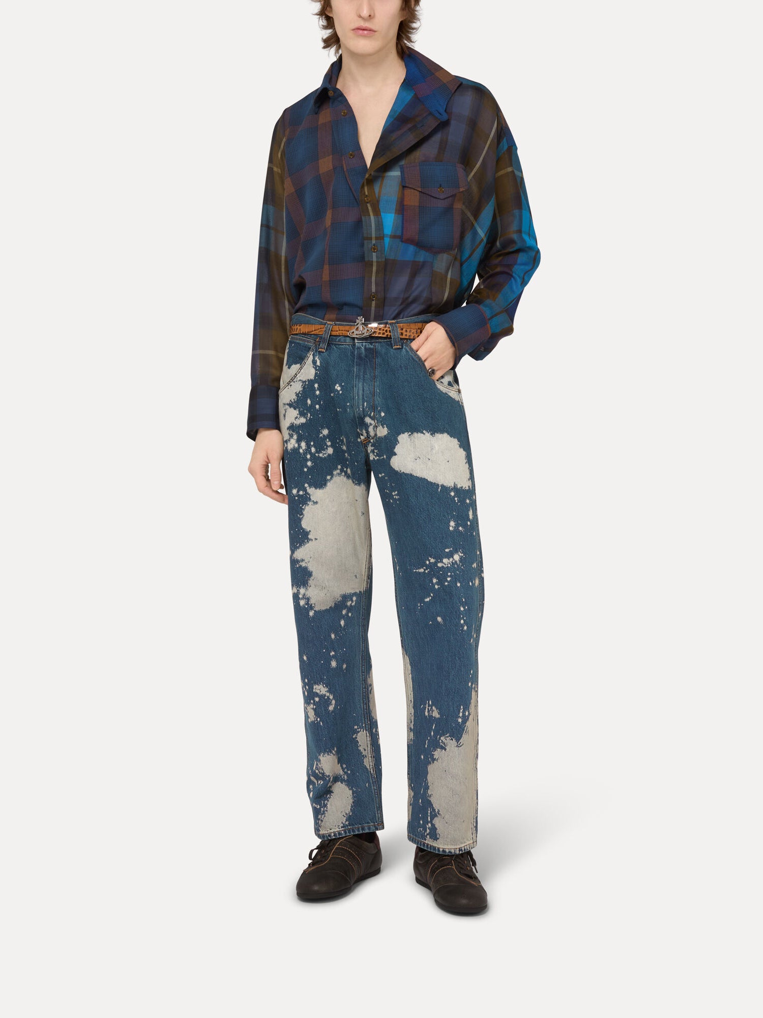 Model wearing Vivienne Westwood Chaos Shirt in Multi with mismatched check panels, front button fastening and asymmetric silhouette