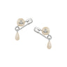 Pair of pearl earrings from Vivienne Westwood with safety pin design on a white background