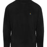 Black turtleneck sweater with a small embroidered brand logo on a white background