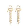 Ginetta Earrings in Gold by Vivienne Westwood, front view of gold-tone drop earring pair featuring safety-pin bar, mixed ball and chunky link chain drops and miniature Orb charm, hoop fastening, Spring/Summer 2026