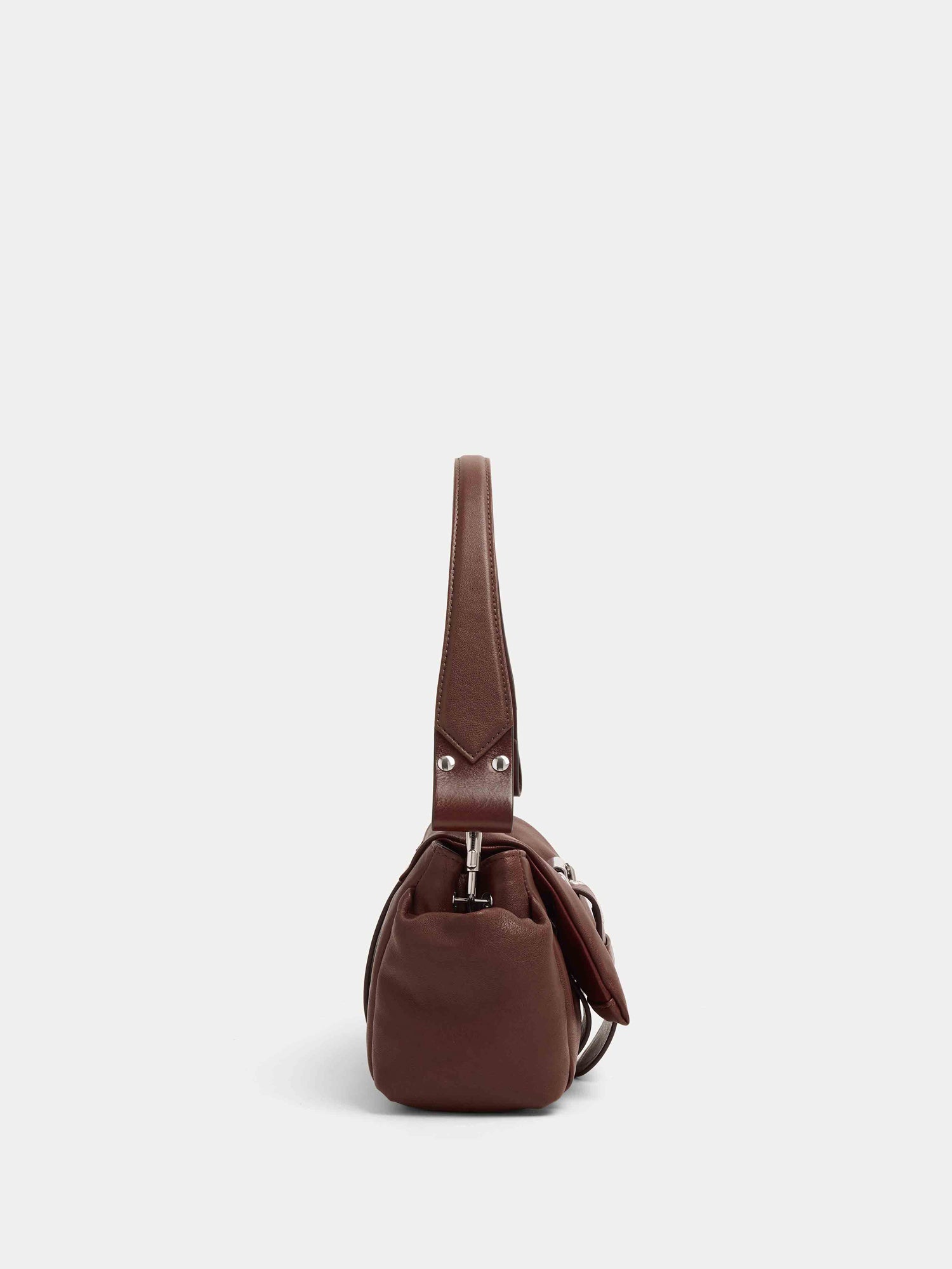 Side profile of Vivienne Westwood Hazel Treasure Handbag in chestnut leather showing top handle, soft structure and compact depth