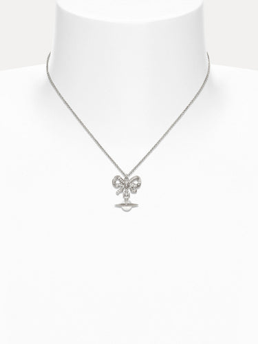 Necklace with a bow pendant on a mannequin against a white background