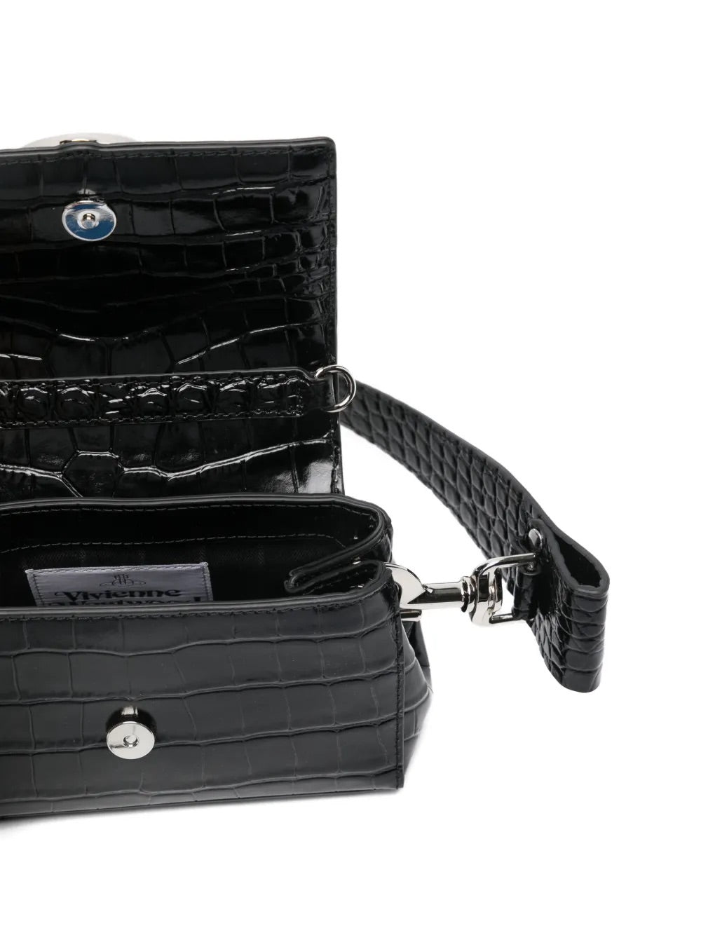 Hazel Small Handbag in Black by Vivienne Westwood, open view showing interior compartment and front flap with signature Orb hardware, black crocodile-embossed leather exterior, Spring/Summer 2026