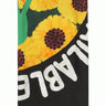 Black scarf with sunflower illustration from Walter Van Beirendonck, folded in half.