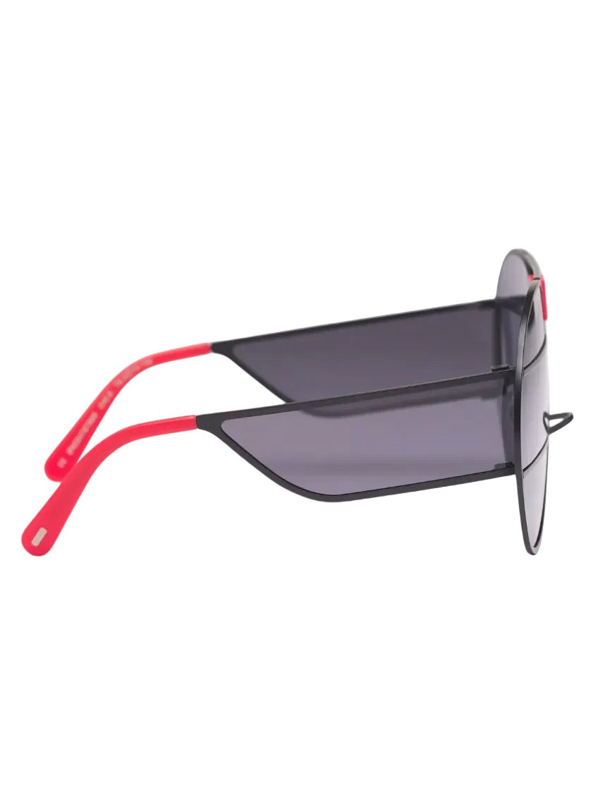 Side view of Walter Van Beirendonck x Komono Brutal Pilot Sunglasses showing black frame, striped lenses and red temple tips