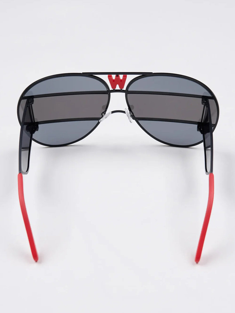 Walter Van Beirendonck x Komono Brutal Pilot sunglasses, interior view showing lens construction and red temple tips