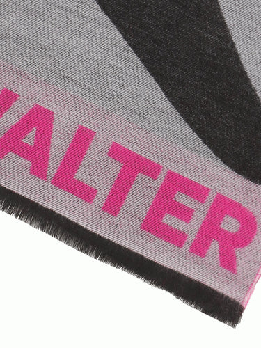 Close-up of the black and pink scarf with alien illustration by Walter Van Beirendonck