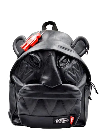 Walter Van Beirendonck Walter Pak'r backpack in black faux leather with sculptural face details, dimensional ears and red character charm.