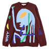 Knitted bordeaux sweater with alien illustration from Walter Van Beirendonck on a white background.