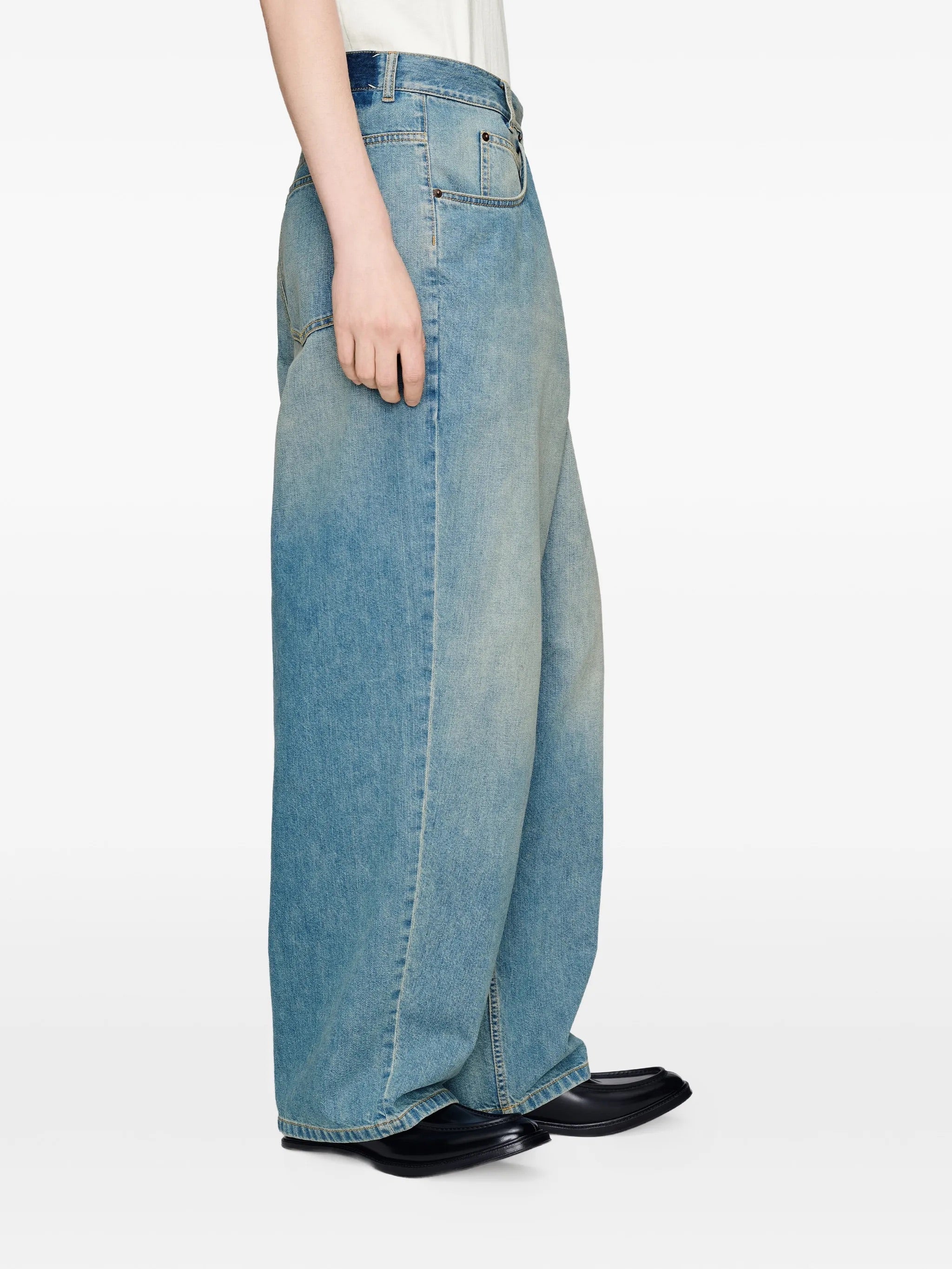 Side view of Maison Margiela Wrap Denim Trousers in Old Blue