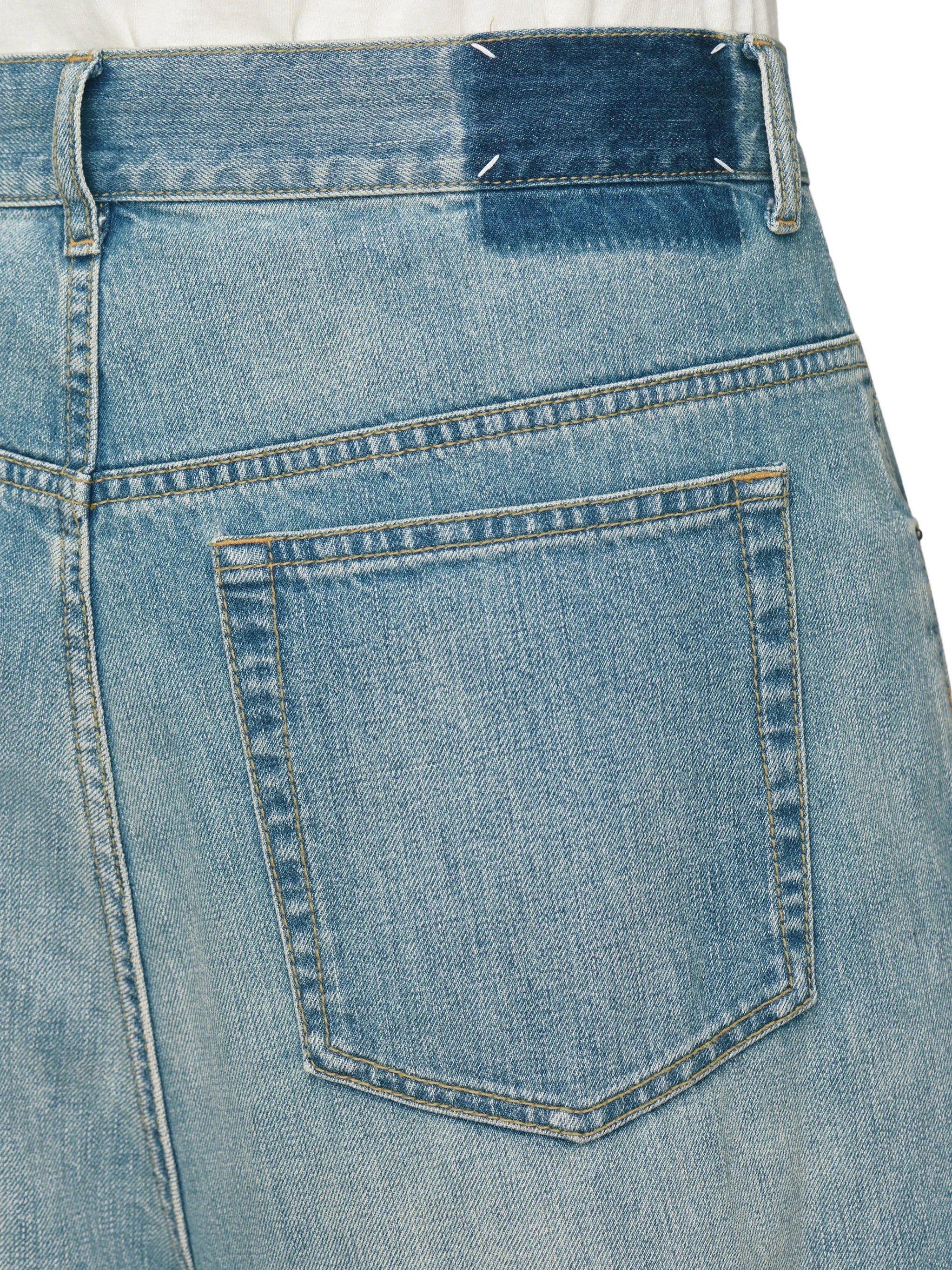 Close-up of back pocket and signature four stitches on Maison Margiela Wrap Denim Trousers