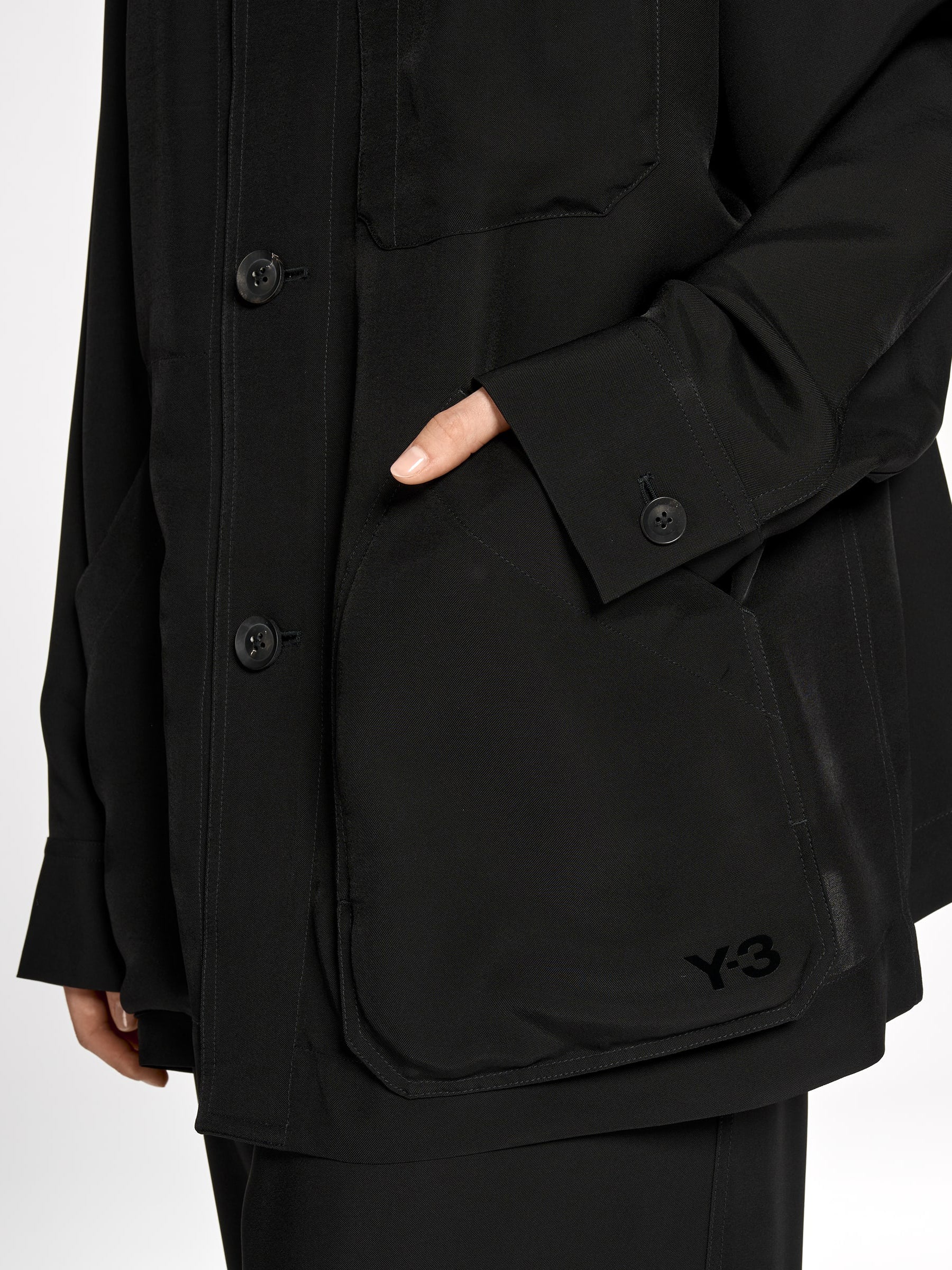 Close-up of the front of the Y-3 Chore Jacket Shirt in Black on a model, showing the woven plain weave texture and relaxed fit.