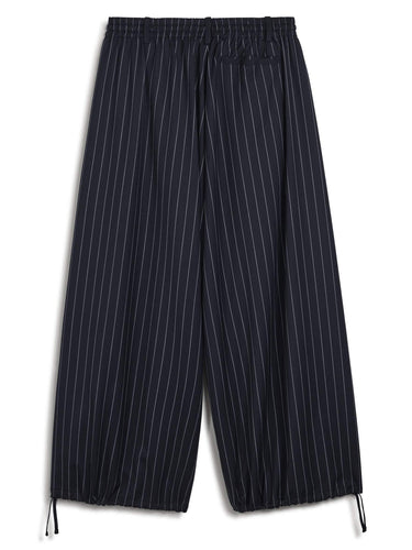 Back packshot of the Y-3 Raw-Cut Wool Pants in Black, highlighting the oversized relaxed fit and plain weave construction.