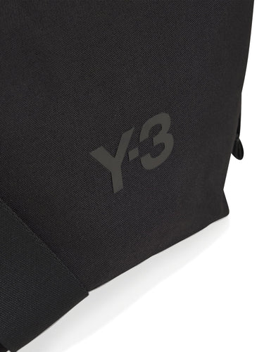 Close-up side detail of the Y-3 Small Crossbody Bag in Black, showing the side zip pocket and textured CORDURA® fabric.