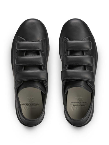 Bird’s-eye view packshot of the Y-3 Stan Smith Hook-and-Loop Shoes in Black, highlighting the hook-and-loop straps and overall shoe silhouette.