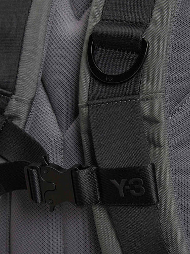 Gray backpack with black straps and Y-3 logo