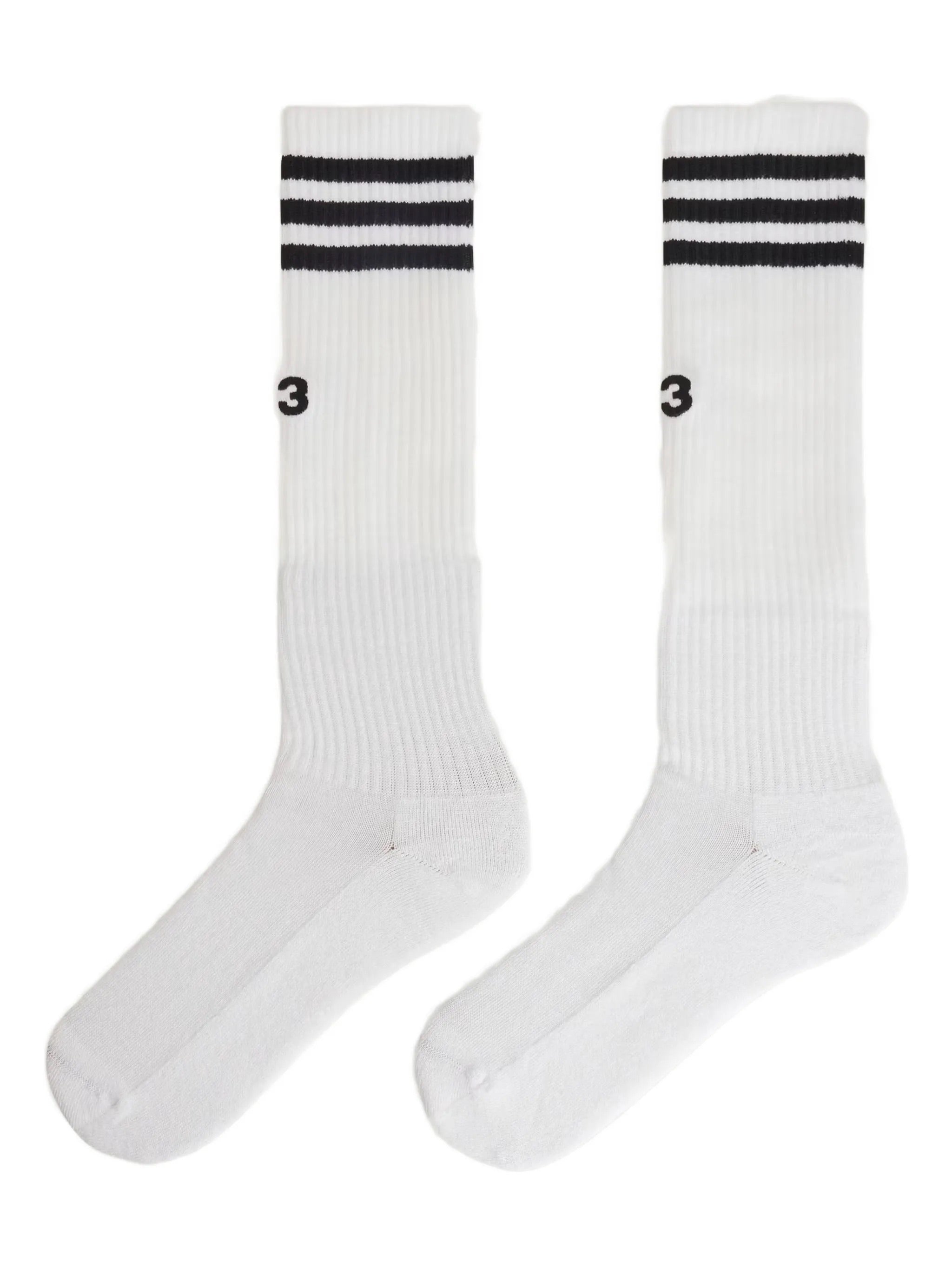 Front packshot of the Y-3 Stripes High Socks in White, showing the knee-length fit, engineered 3-Stripes cuff, and embroidered Y-3 logo at the centre front.