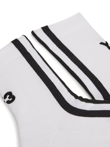 Close-up of the front of the Y-3 Stripes Socks in White, highlighting the 3-Stripes detail and embroidered Y-3 logo on the knit fabric.