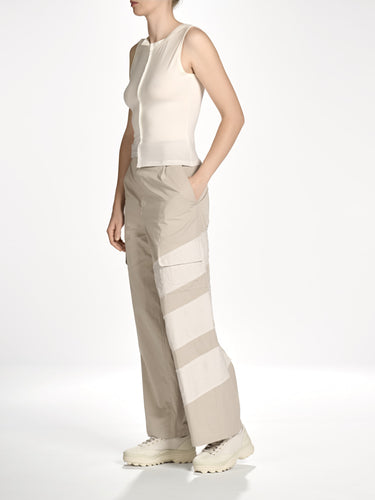 Side view of a female model wearing the Women’s Knit Double-Dye Tank in Beige from Y-3, showing the fitted profile and lightweight single jersey fabric.