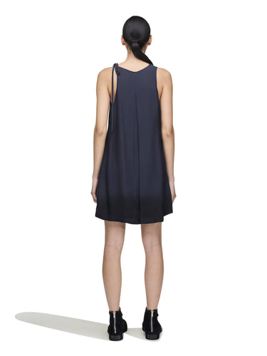 Back view of a female model wearing the Women’s Shirt Double-Dye Dress in night grey and black from Y-3, showing the dip-dye finish and breathable plain-weave fabric.