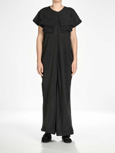 Front view of a female model wearing the Y-3 Women’s Utility Dress in Black, showing the loose silhouette and comfortable drape.