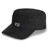Side-front packshot of the Y-3 Workwear Cap in Black, showing the curved brim, structured fit, and silicone Y-3 logo at the centre front.